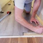 floor-level-view-of-laminate-flooring-installation-home-renovation-construction-materials-tiles.jpg